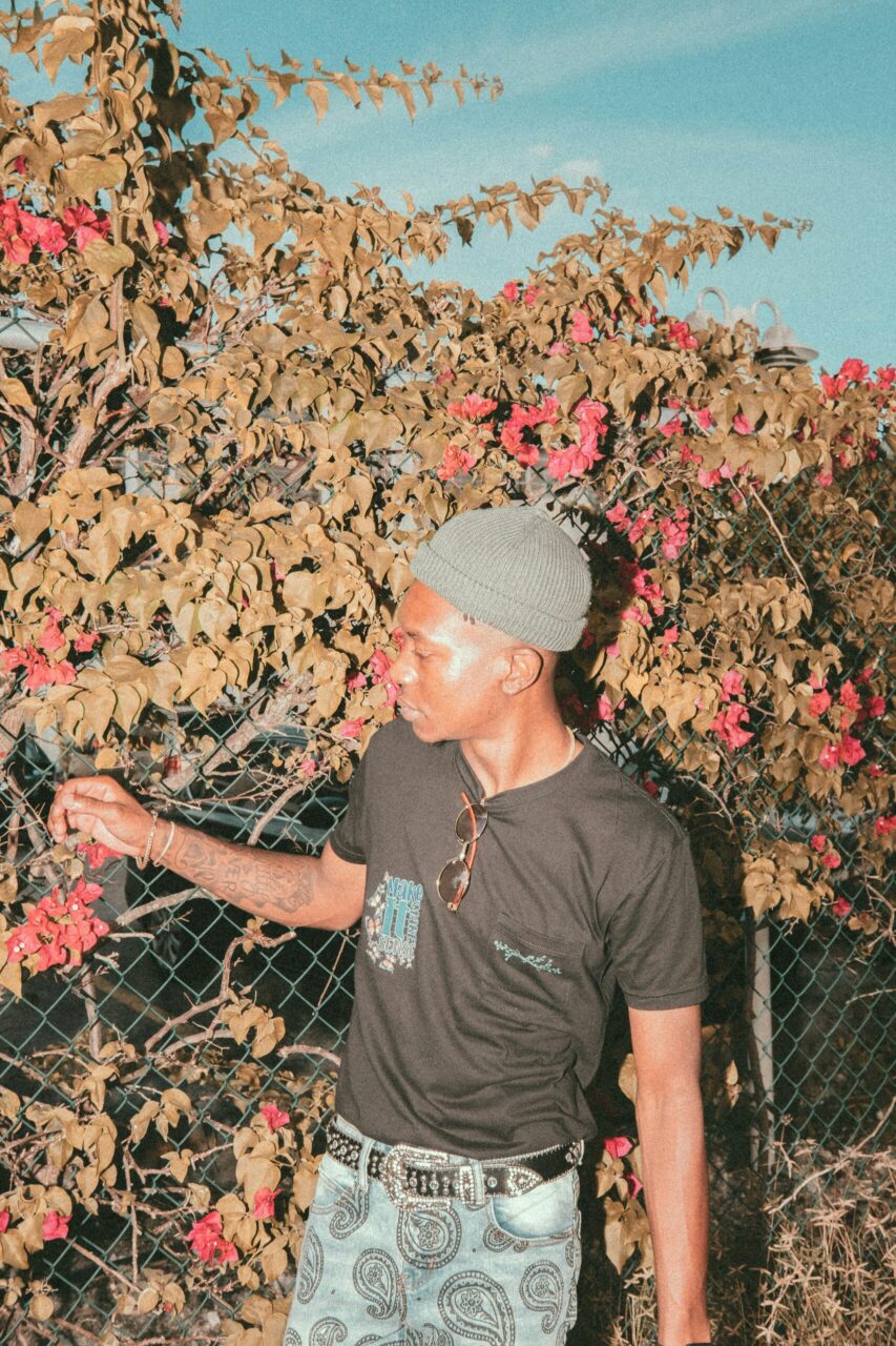 Man standing in front of a fall tree