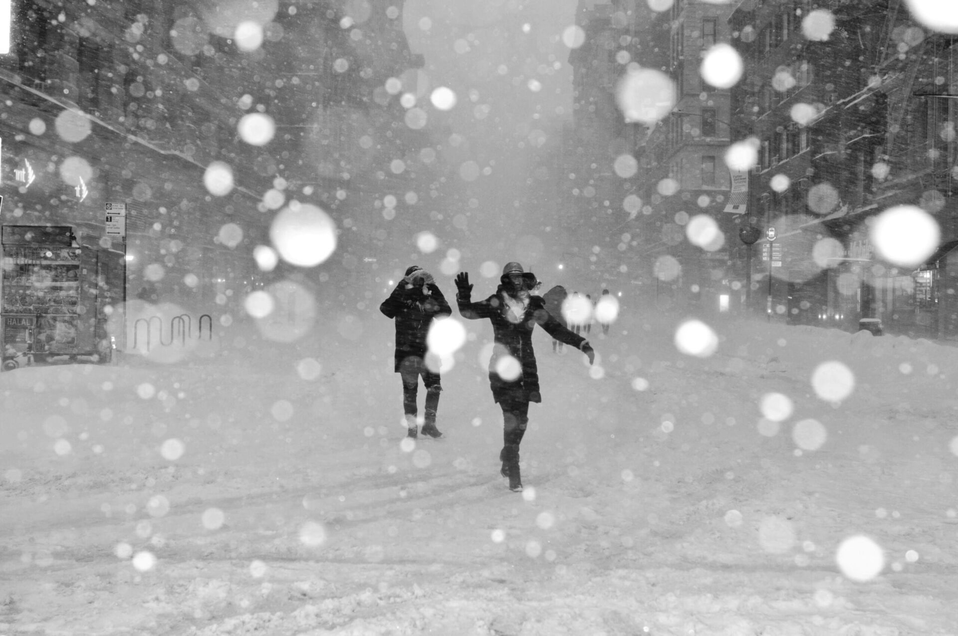 People smiling while walking in the snow