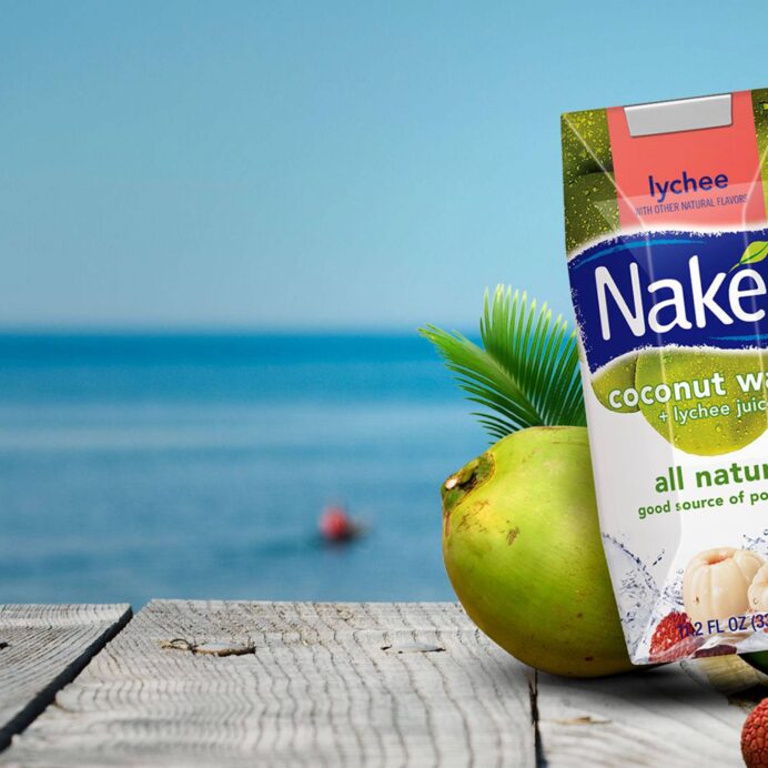 Naked Coconut Water on a dock by the water