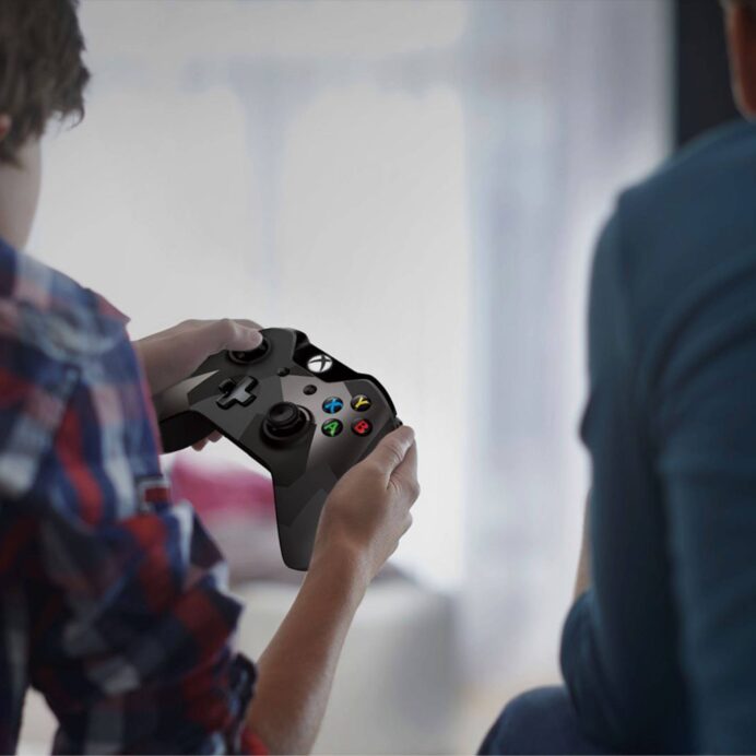 Person holding an Xbox controller