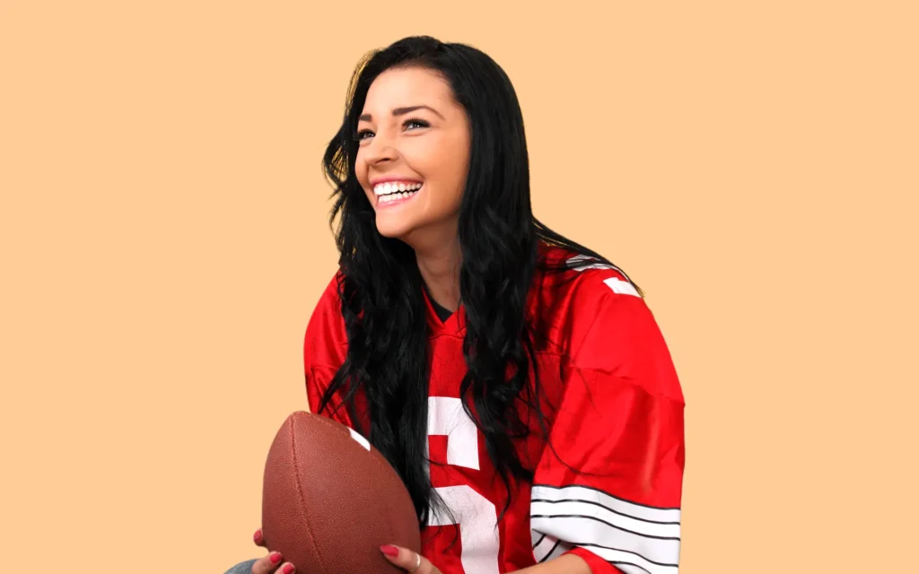 girl wearing a football jersey