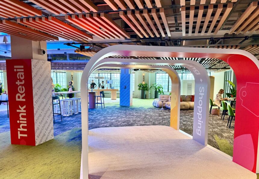 Event space at Google Think Retail 2025 featuring colorful archway installations with “Think Retail” and “Shopping” signage.