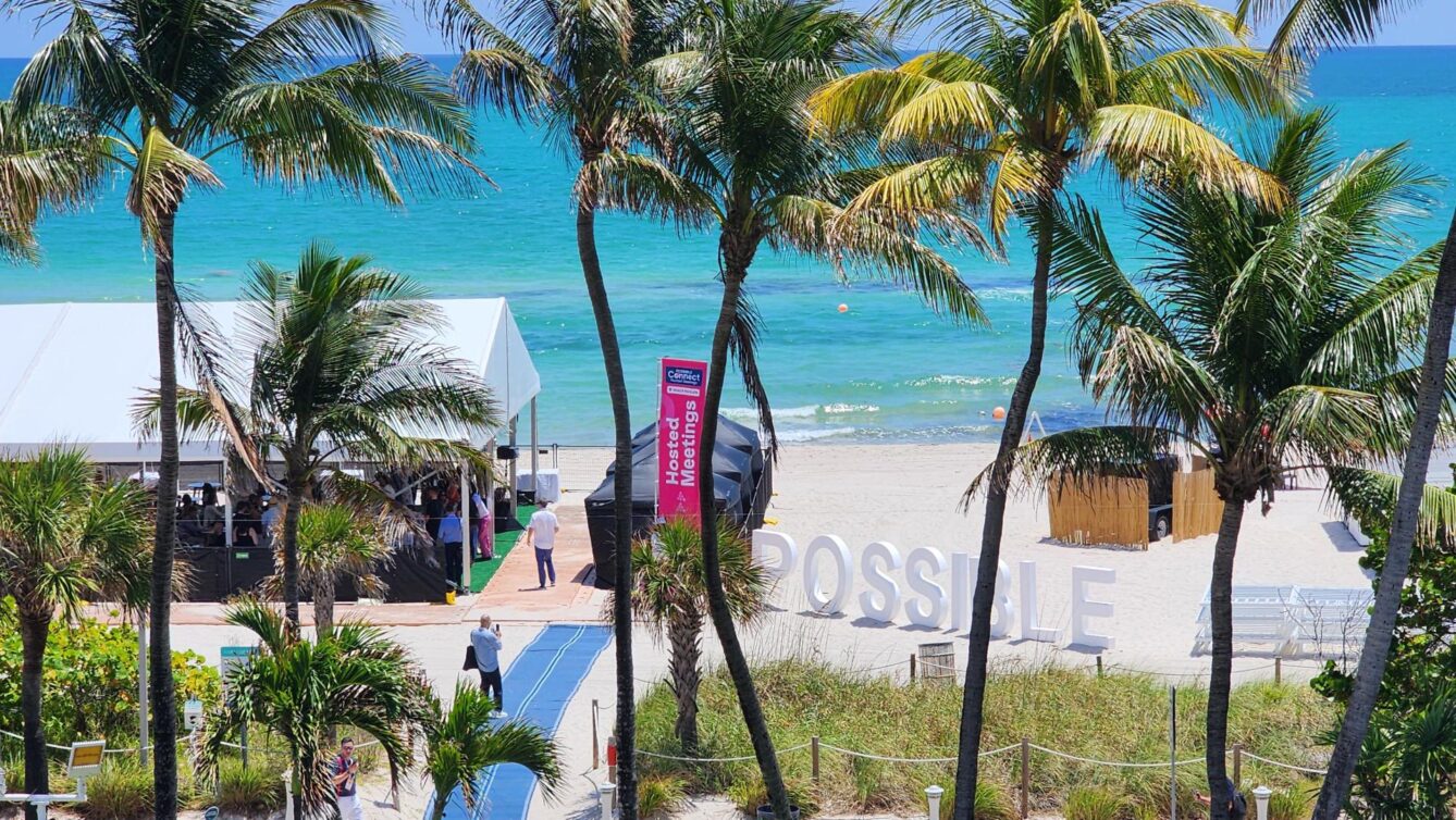 Miami beachfront with large standalone sign reading POSSIBLE