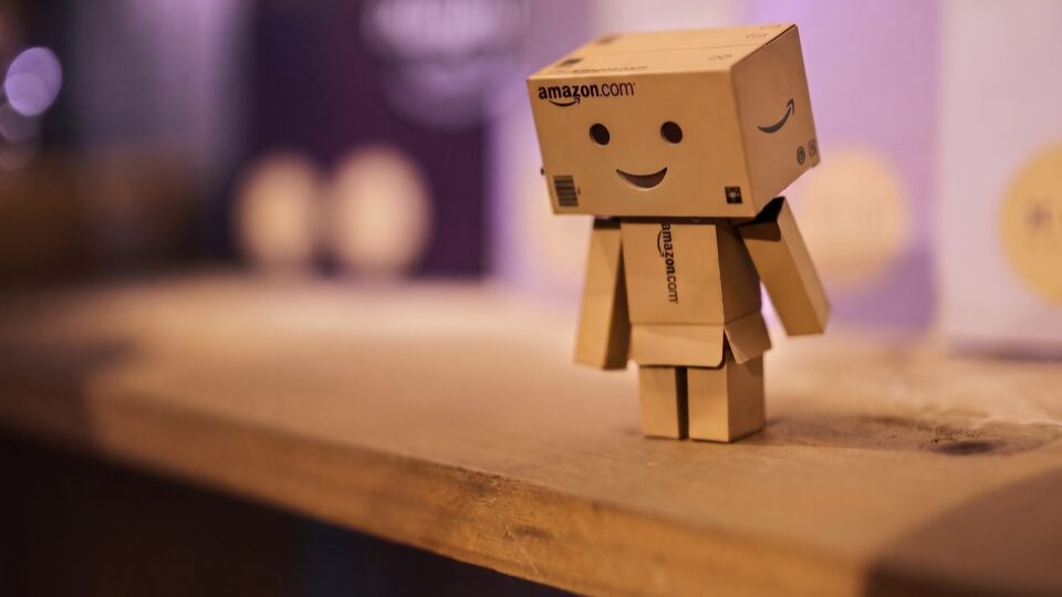 Image of cute smiling robot made out of Amazon Prime cardboard boxes