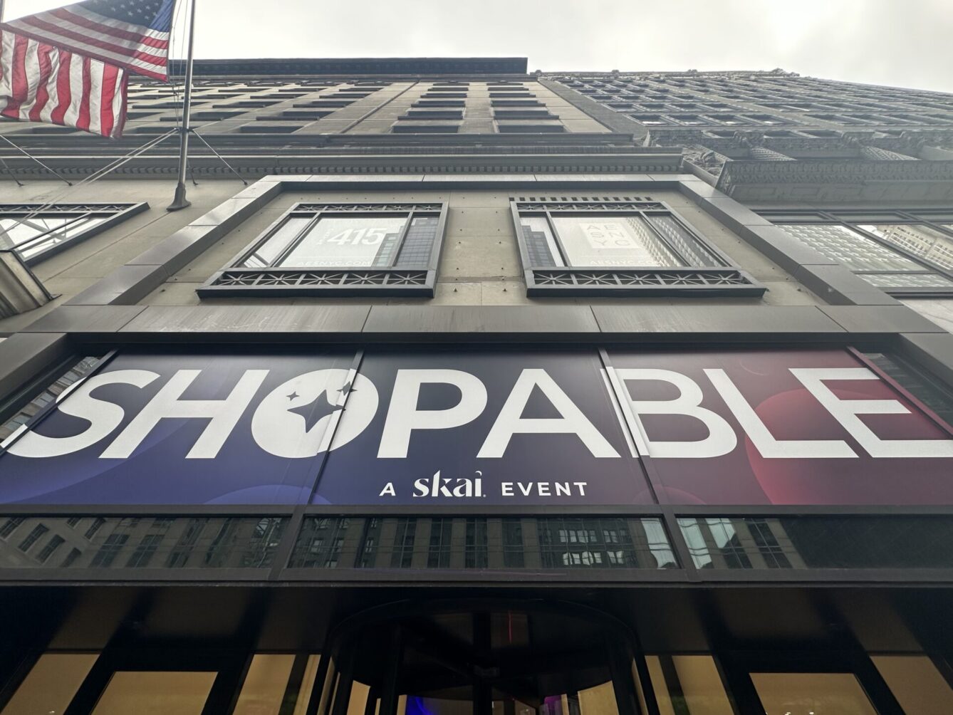 Image features a banner over a NYC doorway with the words SHOPABLE
