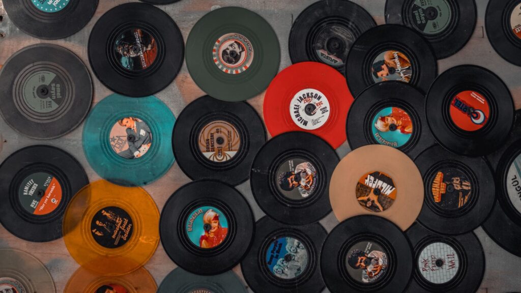 vinyl records laid out on the floor